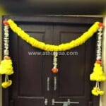 Yellow flower with side hangings Toran