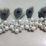 Peacock feather brooch