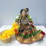Sitting Aandal Doll Making Garland